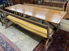 A rectangular pine kitchen table, width 218cm, depth 77cm, height 77cm together with a pair of