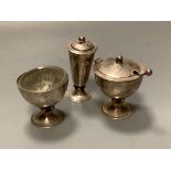 A stylish Art Deco planished silver three piece condiment set and matching spoon, by Charles Boyton,