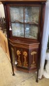 A late Victorian Art Nouveau marquetry inlaid and cross banded mahogany standing corner cabinet,