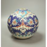 A Turkish Ottoman earthenware hanging mosque bowl, Isnik design, 19cm high