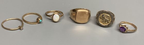 Four assorted modern 9ct gold and gem set rings, a 9ct gold signet ring(cut) and a white metal