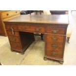 An Edwardian walnut pedestal desk, length 122cm, depth 68cm, height 78cm