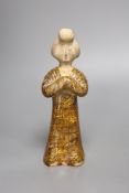A standing pottery figure of an aristocratic Chinese lady, rare marbled clay, Tang dynasty or later,