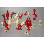 A 19th century bone natural and red bone chess set