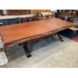 A South African Camelthorn hardwood dining table with a metal x-frame base, length 256cm, width