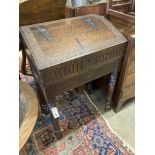 A 17th century oak slant front bible box, raised on a stand, width 61cm, depth 37cm, height 87cm