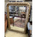 A Victorian arched giltwood overmantel mirror, width 80cm, height 118cm