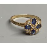 A modern 9ct gold, sapphire and diamond cluster ring, size O, gross 2.2 grams.