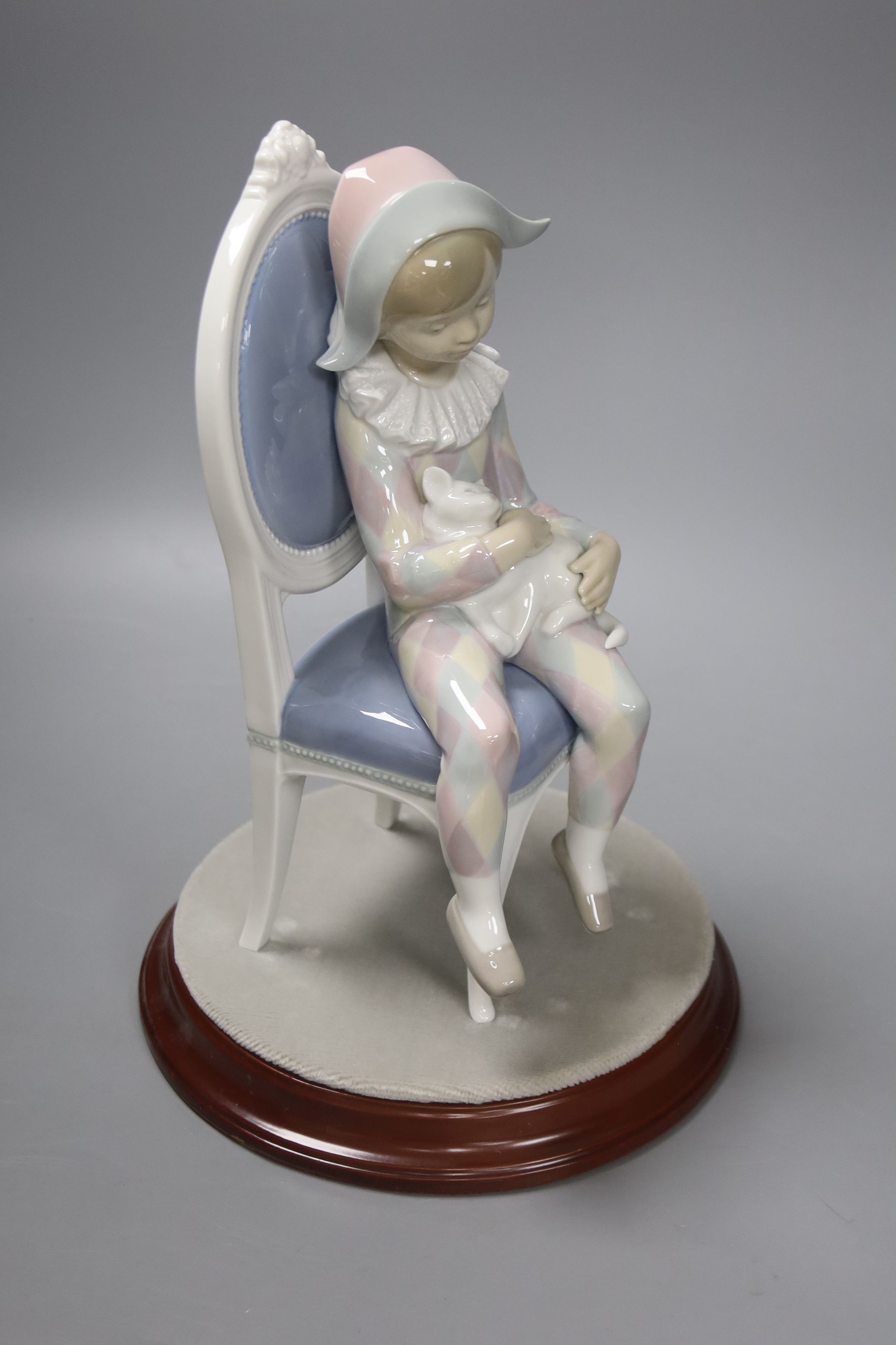 A Lladro figure of Harlequin Boy with cat sitting on a chair, no. 1229, 30cm high - Image 2 of 3