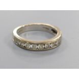 A diamond and 18ct white gold half eternity ring, size M, gross 4.5 grams.