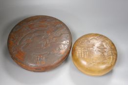 Two Japanese shallow carved wood circular lidded boxes, largest 27cm diameter