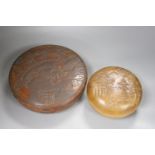 Two Japanese shallow carved wood circular lidded boxes, largest 27cm diameter