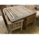 A Heals type weathered square teak garden table, 90cm, height 72cm and four chairs