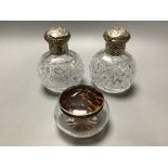 A pair of late Victorian silver mounted cut glass scent bottles, London, 1887, height 13.1 cm and