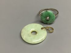 A 9ct white metal, jade and diamond set disc ring, size M, gross 2.1 grams and a 14k mounted jade