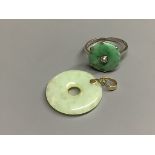 A 9ct white metal, jade and diamond set disc ring, size M, gross 2.1 grams and a 14k mounted jade