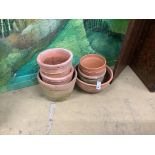 Seven various terracotta garden planters, largest 40cm diameter