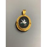 A late Victorian yellow metal and pietra dura set oval pendant brooch, depicting a dove, overall