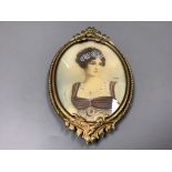 A portrait miniature of a lady, in a brass frame