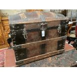 A late Victorian leather and metal mounted dome top trunk with scrap-work interior, length 76cm,