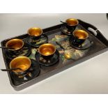 A Chinese papier mache teaset on tray