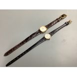 Two lady's modern 9ct gold quartz wrist watches, Omega and Avia, on leather straps, gross 19.3