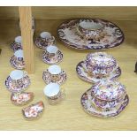 A collection of Royal Crown Derby Imari patterned ceramics including cups, side plates and platter