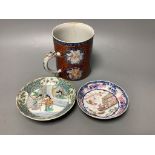 An 18th century Chinese export tankard and two 18th/19th century saucer dishes, tallest 13cm