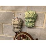 A pair of reconstituted stone wall appliques of 'The Green Man', width 18cm, height 28cm