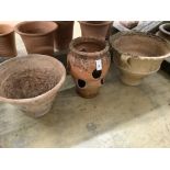 Two terracotta planters and a terracotta strawberry planter, largest 52cm diameter