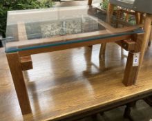 A John Makepeace square glass top coffee table, width 64cm, height 35cm