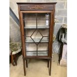 An Edwardian stencil decorated mahogany display cabinet, width 59cm, depth 29cm, height 141cm