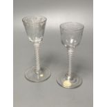 Two George III double series opaque twist stem cordial glasses, c.1760-70, with wheel engraved