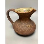 Waistel Cooper (1921-2003). A pottery jug with textured glazed body, height 18cm