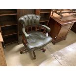 A reproduction captain's chair, width 64cm, depth 58cm, height 84cm