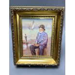 A framed porcelain plaque painted by Francis Clark, depicting a fisherman smoking his pipe17.
