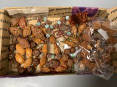 Various Chinese peach stone and nut carvings, bead necklaces, bangles etc