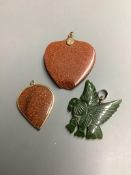Two adventurine glass pendants, one a.f. and one other carved hardstone pendant.