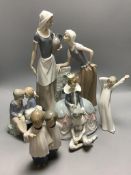 Four Nao figures and a Lladro group