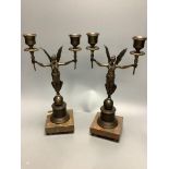 A pair of modern bronze figural two sconce candlesticks, height 32cm
