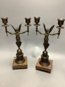 A pair of modern bronze figural two sconce candlesticks, height 32cm
