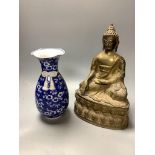 A bronze figure of a seated Buddha and a Japanese blue and white ovoid vase, of 'sack' form with