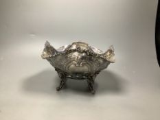 A late Victorian embossed silver fruit bowl, decorated with scrolls, baskets of fruit and masks,