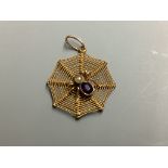 A 9ct, amethyst and seed paerl set 'spider in web' pendant,22mm, gross 1.1 grams.