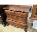 A 19th century and later Dutch mahogany bombe chest of three long drawers, raised on claw and ball