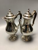 A George V silver café au lait pair of balluster form, Daniel and John Welby, London, 1912, height
