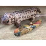 A decorative 20th century Brazilian carved wood dog and a painted carved wood parrot, longest