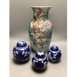 A Chinese enamelled porcelain baluster vase and three Chinese prunus blossom ginger jars, tallest