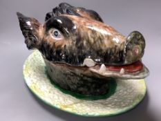 A Portuguese maiolica boar’s- head tureen, cover and stand, length 40cm
