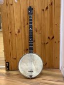 A cased banjo, unmarked